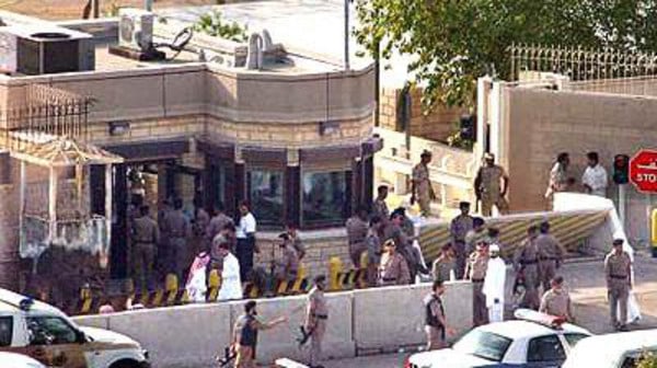 Saudi forces gather outside the gates of the U.S. consulate in Jiddah, Saudi Arabia, Monday, Dec. 6, 2004, following a terrorist attack which killed at least 12 people. Islamic militants threw explosives at the gate of the heavily guarded consulate in Jiddah, then forced their way in and held hostages at gunpoint, in a bold assualt that prompted a three hour gunbattle. The Interior Ministry said three of the five attackers were killed. (AP Photo/Saudi Gazette) ** SAUDI ARABIA OUT **